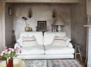 <p>"This cream sofa is like sitting on a cloud... it’s so comfortable and came out of a house clearance in Holland Park. The giant pouffe takes centre stage in this room measuring 2.5m long and 1m wide. It's my favourite and one of my only new purchases from Anthropologie."</p>