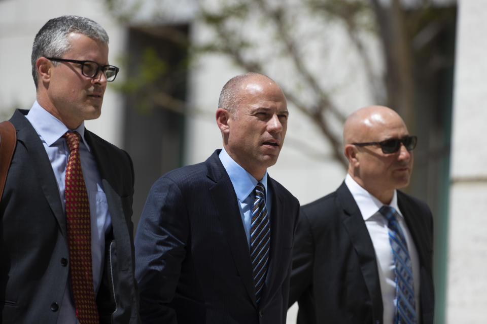 Attorney Michael Avenatti, center, arrives at federal court Monday, April 1, 2019, in Santa Ana, Calif. Avenatti appeared in federal court on charges he fraudulently obtained $4 million in bank loans and pocketed $1.6 million that belonged to a client. (AP Photo/Jae C. Hong)