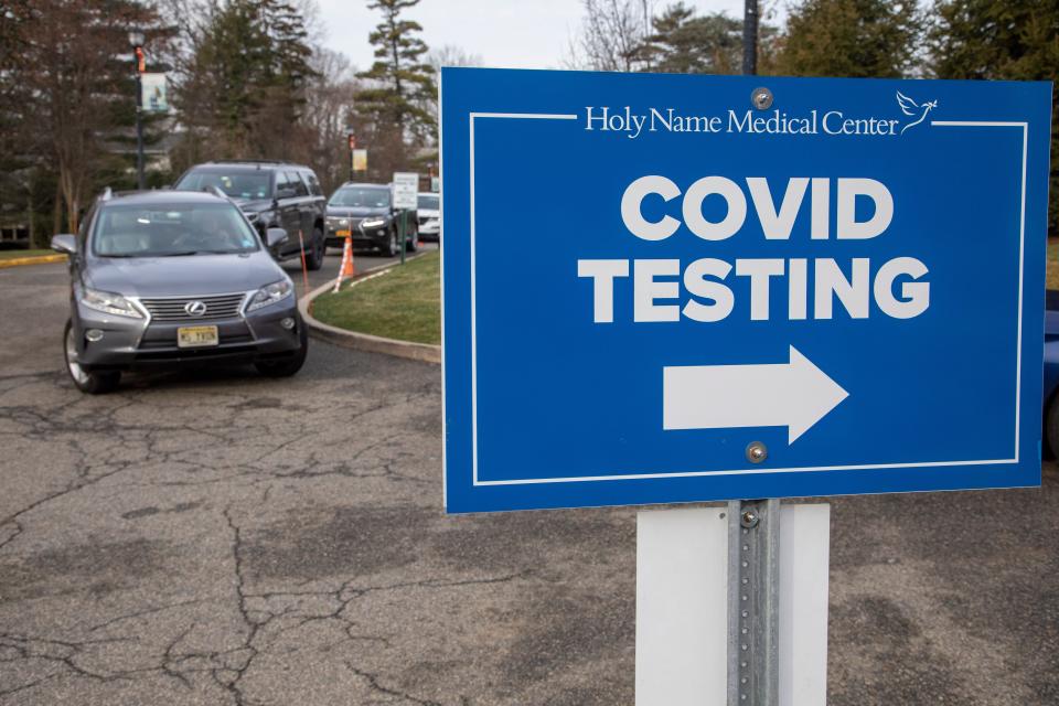 Lines of cars wait to drive through the Holy Name COVID-19 testing site to be swabbed by caregivers at Holy Name Medical Center in Teaneck. The site is currently testing 400-500 people daily.