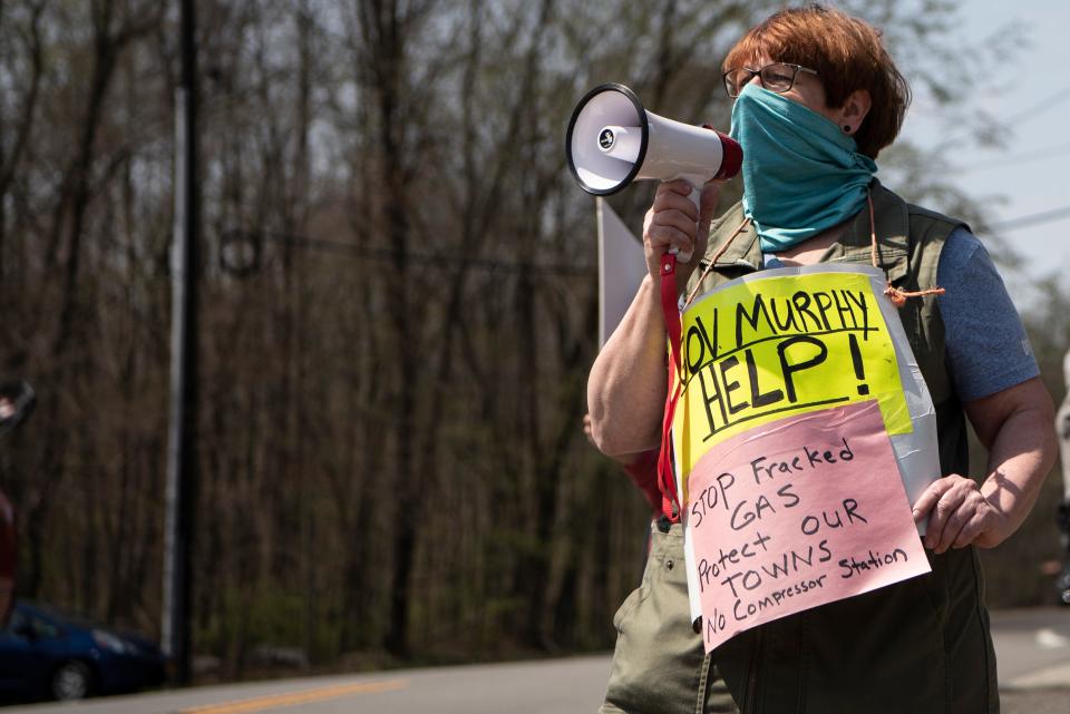 People gather in West Milford on Saturday April 24, 2021 to protest the Tennessee Gas Pipeline Company and the two proposed gas compressors along their pipeline. One would be in Wantage and one in West Milford. Laura Ashtyani, a West Milford resident uses a bullhorn.