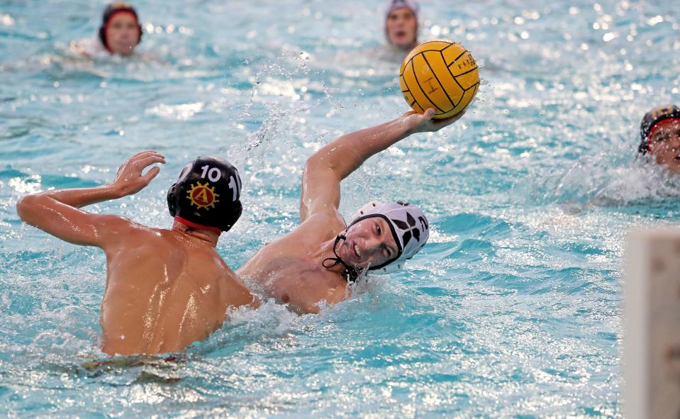 Corbin Chuck of Xavier Prep scores during the Desert Empire League water polo championship game against Palm Desert High in Indio, Calif., on Wed., October 25, 2023.