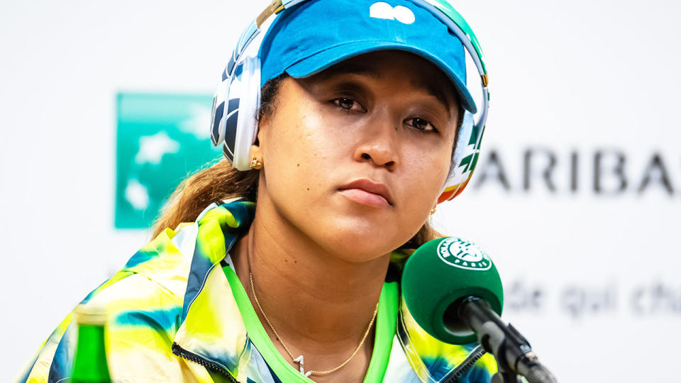 Naomi Osaka, pictured here speaking to the media after her loss at the French Open.