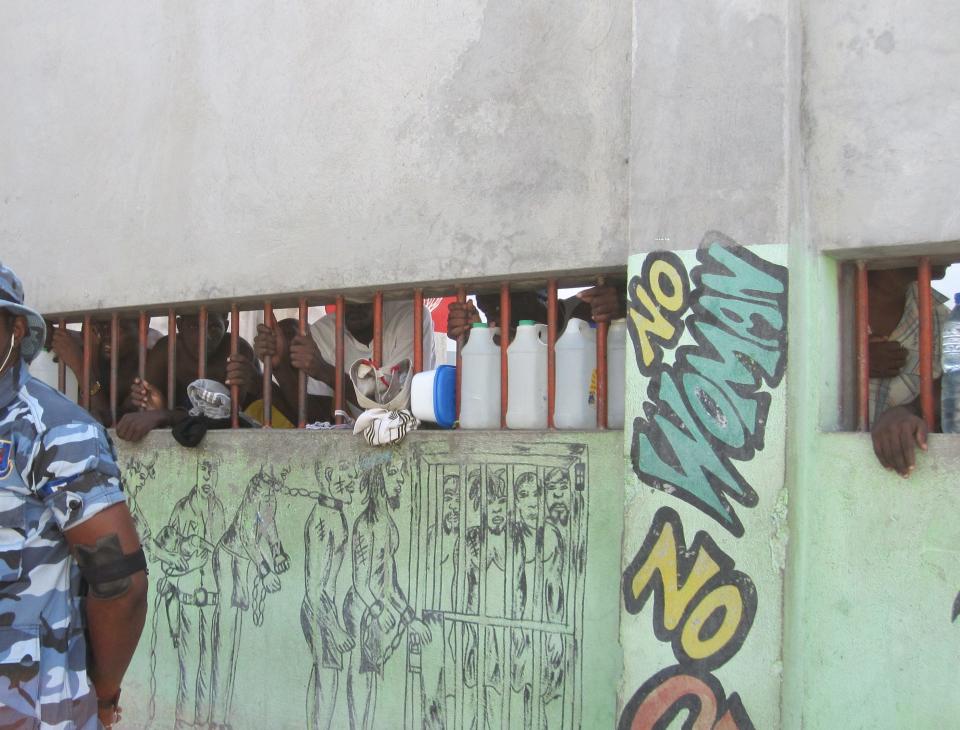 Prisoners at Haiti's overcrowded National Penitentiary in 2013. Built to hold fewer than a 1000 people, it held more than 4,000 at this time.