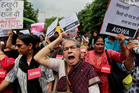 Protest demanding investigation in highway collision in which woman fighting rape case against BJP legislator was injured, in New Delhi