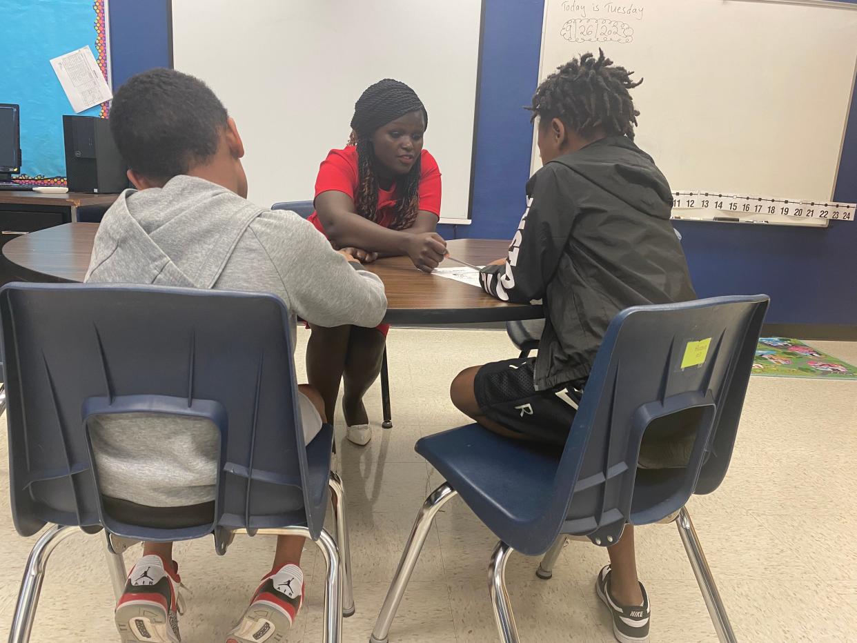 Naomi Kingori, a learning specialist from Kenya, on Tuesday with her students at West Boulevard Elementary School.