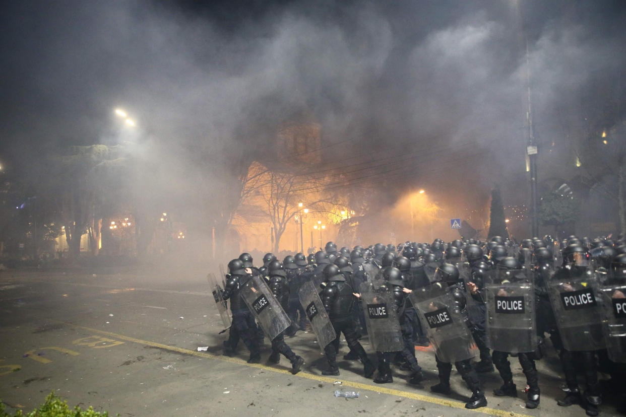 Police in riot gear face protesters in Tbilisi late on March 8, 2023. (Zura Tsertsvadze / AFP - Getty Images)