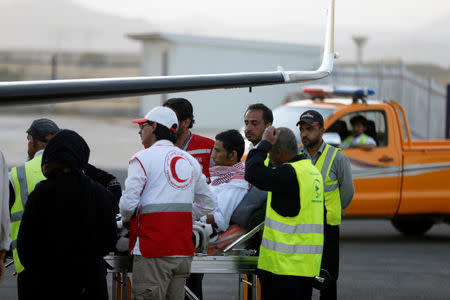 Saudi prisoner Moussa Awaji is taken on a stretcher to an ICRC plane at the Sanaa airport after he was released by the Houthis in Sanaa, Yemen January 29, 2019. REUTERS/Khaled Abdullah