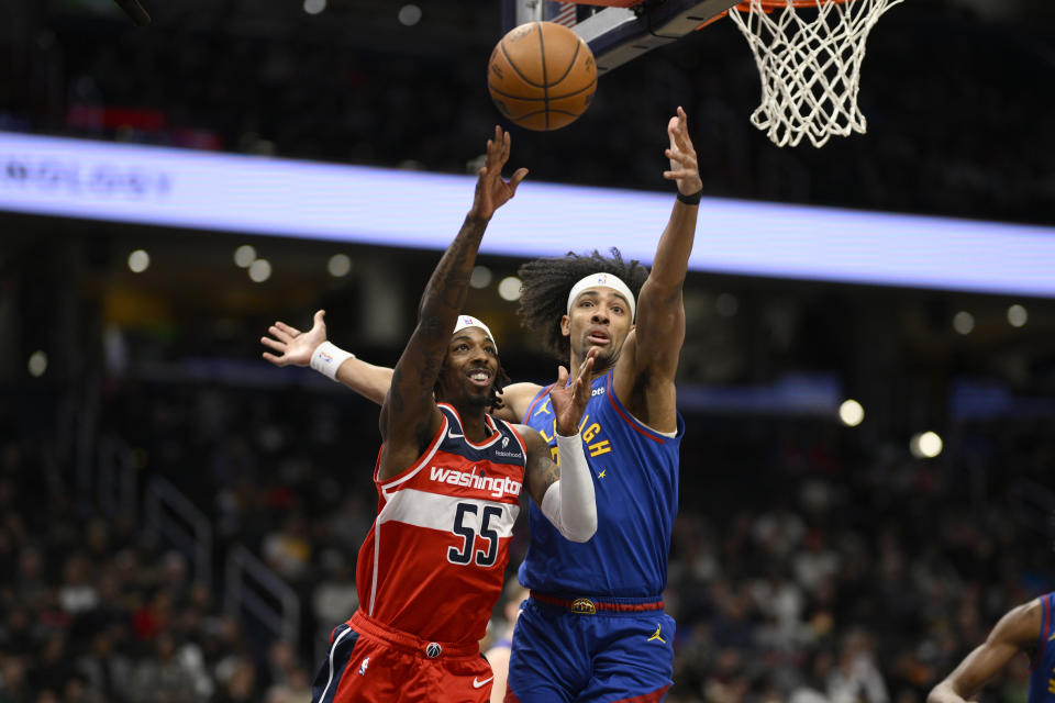 Washington Wizards guard Delon Wright (55) passes against Denver Nuggets forward Zeke Nnaji, right, during the first half of an NBA basketball game, Sunday, Jan. 21, 2024, in Washington. (AP Photo/Nick Wass)