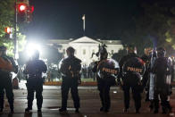 Police form a line on H Street as demonstrators gather to protest the death of George Floyd, Sunday, May 31, 2020, near the White House in Washington. Floyd died after being restrained by Minneapolis police officers (AP Photo/Alex Brandon)