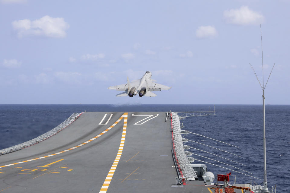 In this photo released by Xinhua News Agency, a J-15 Chinese fighter jet takes off from the Shandong aircraft carrier during the combat readiness patrol and military exercises around the Taiwan Island by the Eastern Theater Command of the Chinese People's Liberation Army (PLA) on Sunday, April 9, 2023. China's military declared Monday it is "ready to fight" after completing three days of large-scale combat exercises around Taiwan that simulated sealing off the island in response to the Taiwanese president's trip to the U.S. last week. (An Ni/Xinhua via AP)