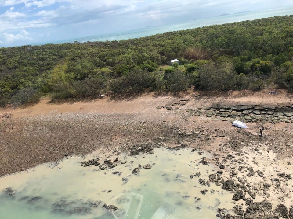 A freak storm smashed a Queensland couple's boat into rocks on Avoid Island. Source: RACQ CQ Rescue