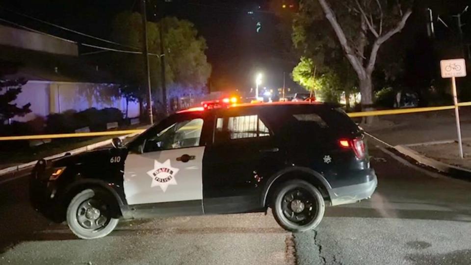 Law enforcement vehicles and police tape block multiple streets Tuesday in Davis, including at Third and L streets, following a stabbing at a homeless encampment overnight. It was the third stabbing in the city in less than a week.