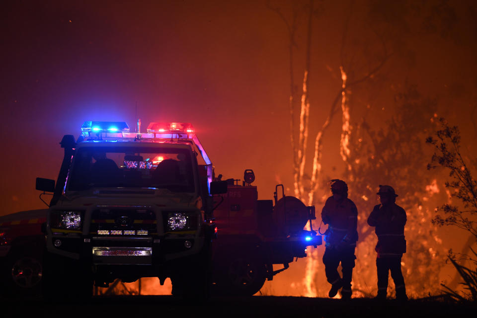 NSW Rural Fire Service crews protect properties on Waratah Road and Kelyknack Road as the Wrights Creek fire approaches Mangrove Mountain, north of Sydney, on December 5. Source: AAP