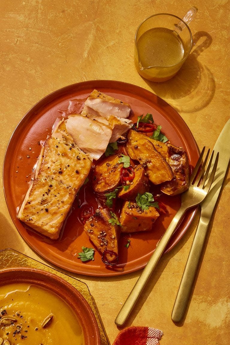 <p>For a healthier dish that's still packed with warmth, try this recipe that uses coriander and chile.</p><p><strong><em><a href="https://www.womansday.com/food-recipes/food-drinks/a25809274/seared-salmon-with-spiced-sweet-potatoes-recipe/" rel="nofollow noopener" target="_blank" data-ylk="slk:Get the Seared Salmon with Spiced Sweet Potatoes recipe.;elm:context_link;itc:0;sec:content-canvas" class="link ">Get the Seared Salmon with Spiced Sweet Potatoes recipe. </a></em></strong></p>