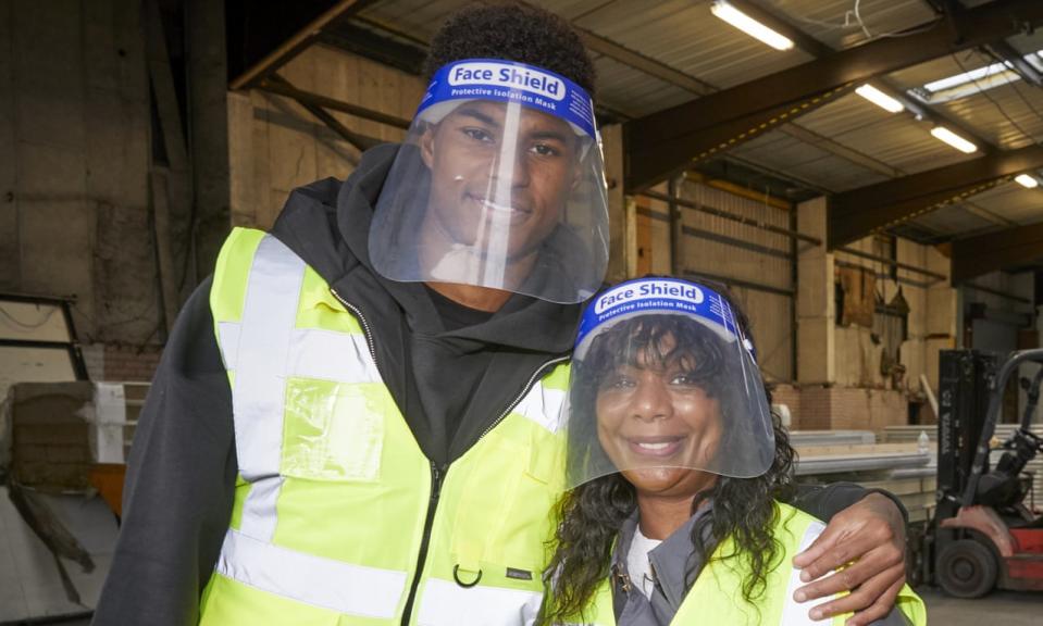 Marcus Rashford and his mother, Melanie, visit FareShare in Greater Manchester on 22 October. Photograph: Mark Waugh/AP