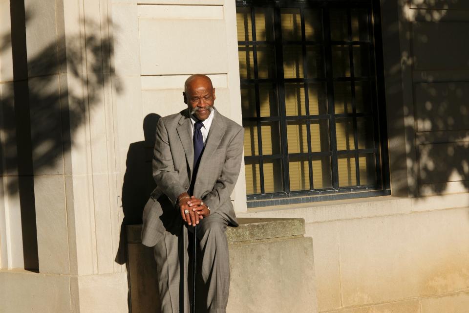 Perry Lott takes a minute in the sun before heading into the courthouse on Tuesday.