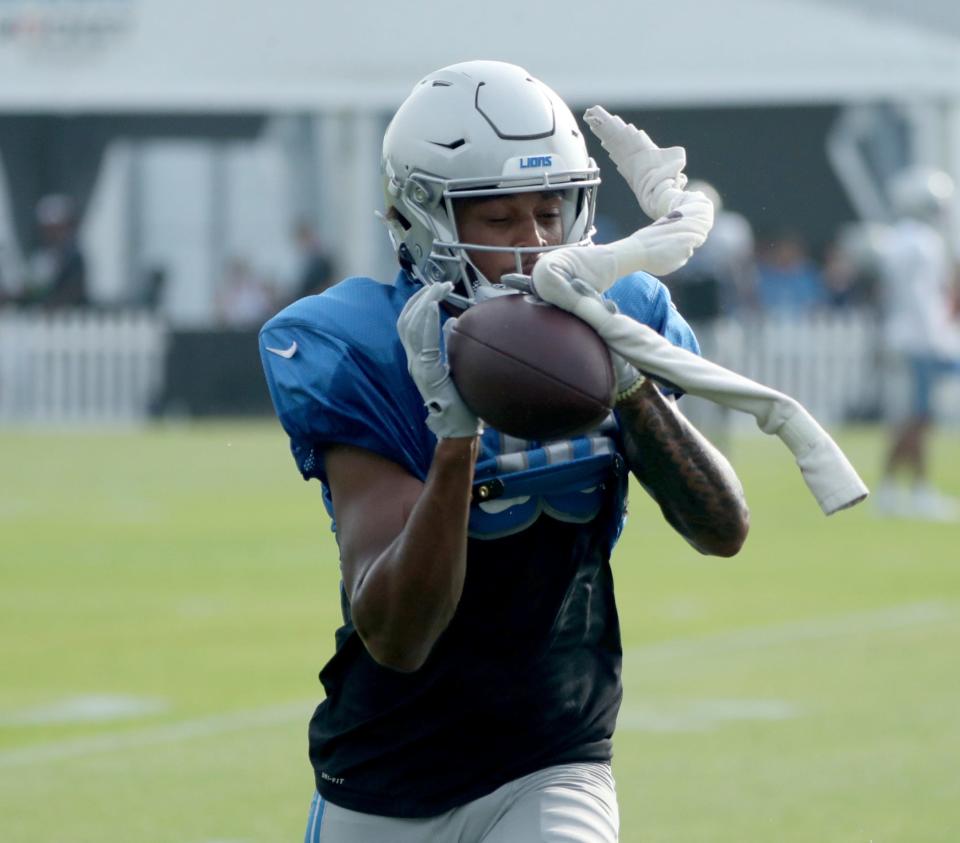 Detroit Lions wide receiver Dylan Drummond (83) catches a pass during training camp at team headquarters in Allen Park on Friday, July 28, 2023.