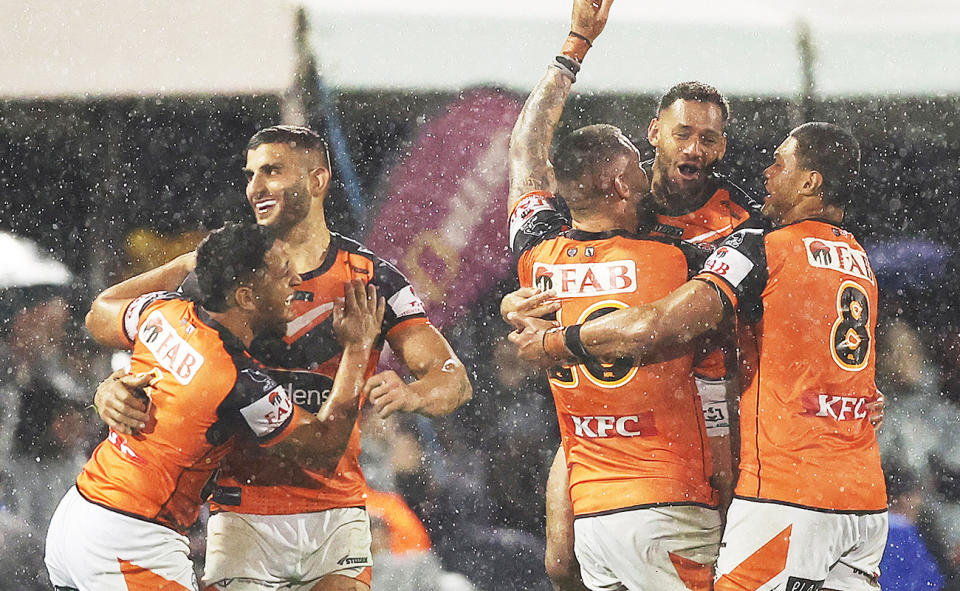 Wests Tigers players, pictured here celebrating after their win over the Panthers.