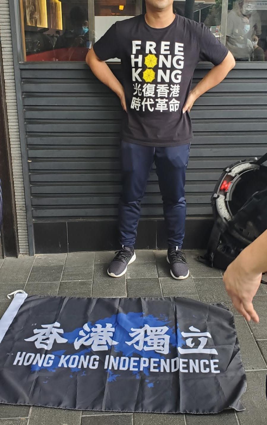 A man found in possession of a Hong Kong independence flag became the first person to be arrested under Beijing's new national security law - HK Police/Twitter