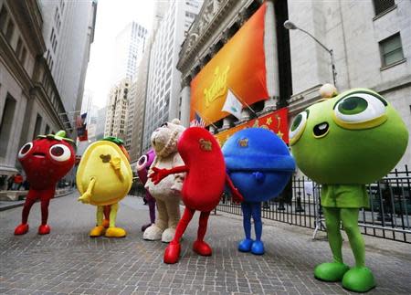 Mascots dressed as characters from the mobile video game "Candy Crush Saga" pose outside the New York Stock Exchange ahead of the IPO of Mobile game maker King Digital Entertainment Plc March 26, 2014. REUTERS/Brendan McDermid