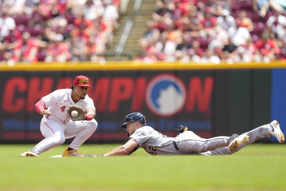 Detroit Tigers' Parker Meadows, right, steals second against Cincinnati Reds second baseman Santiago Espinal (4) in the third inning of a baseball game in Cincinnati, Sunday, July 7, 2024. (AP Photo/Jeff Dean)