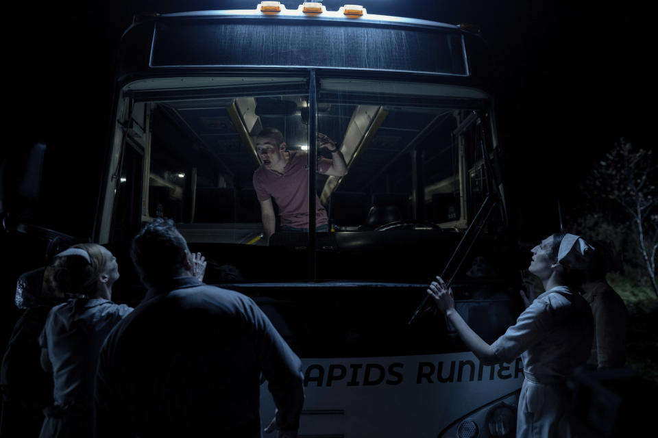 A young man is taunted by humanoid monsters on a bus at night