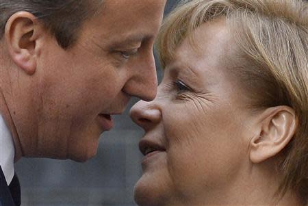 Britain's Prime Minister David Cameron greets German Chancellor Angela Merkel at Number 10 Downing Street in London February 27, 2014. REUTERS/Toby Melville