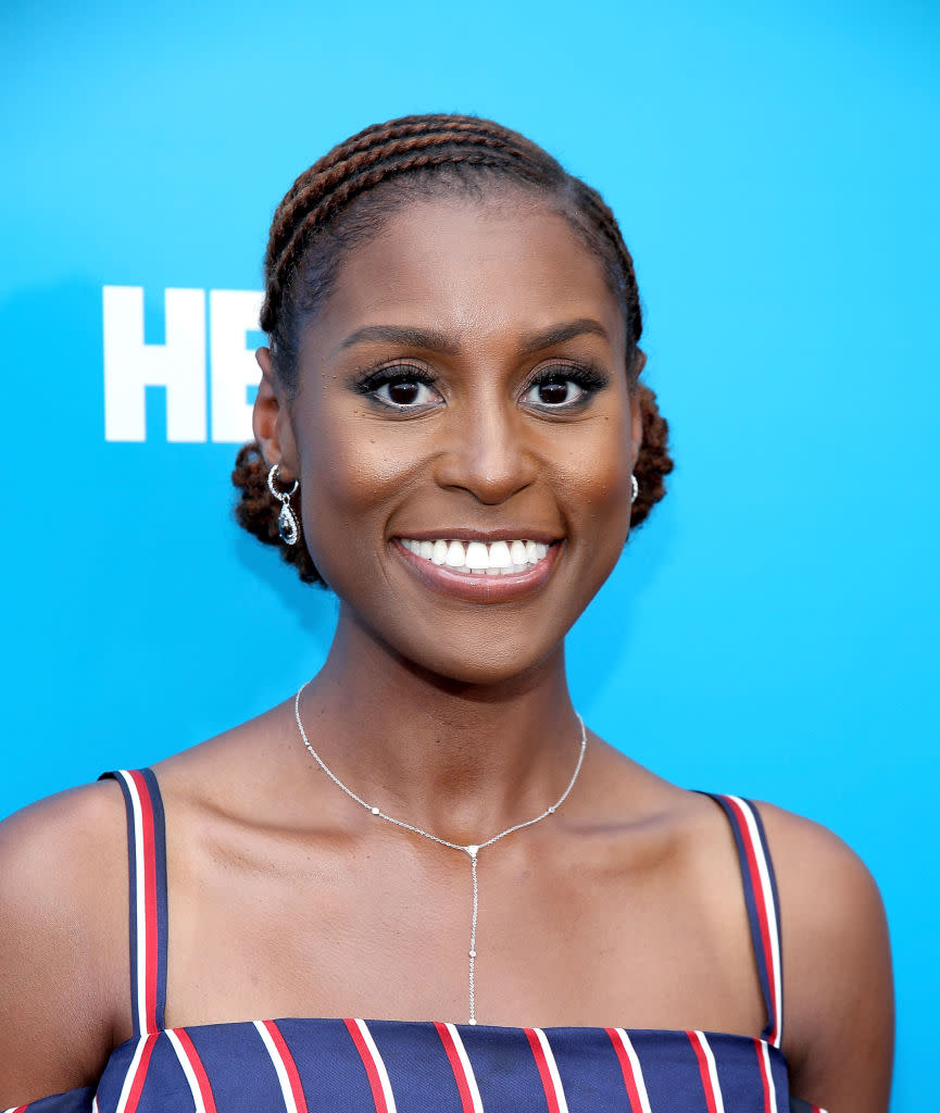 <p><em>Insecure </em>star Issa Rae has been busy promoting (and partying for) the upcoming season of her HBO series. Thanks to hair pro Felicia Leatherwood, the natural hair beauty’s mane is always in check, and this twisted and curly chignon ‘do is also summer-approved. (Photo: Getty Images) </p>