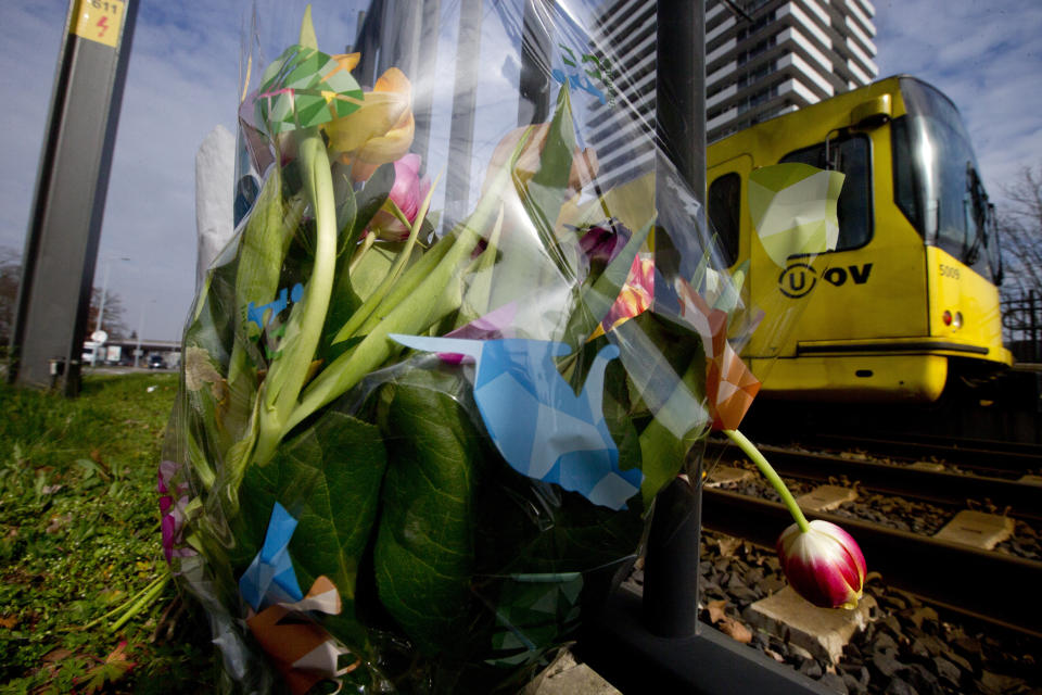 A tram passes flowers placed at the site of a shooting incident on a tram, in Utrecht, Netherlands, March 19, 2019. (Photo: Peter Dejong/AP)