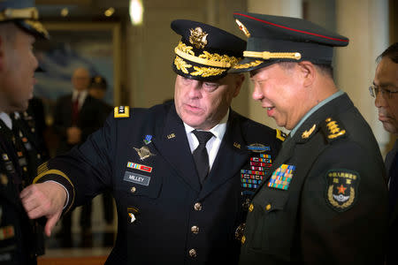 FILE PHOTO: U.S. Army Chief of Staff Gen. Mark Milley, left, introduces members of his staff to China's People's Liberation Army (PLA) Gen. Li Zuocheng, right, in Beijing, Tuesday, Aug. 16, 2016. REUTERS/Mark Schiefelbein/Pool/File Photo