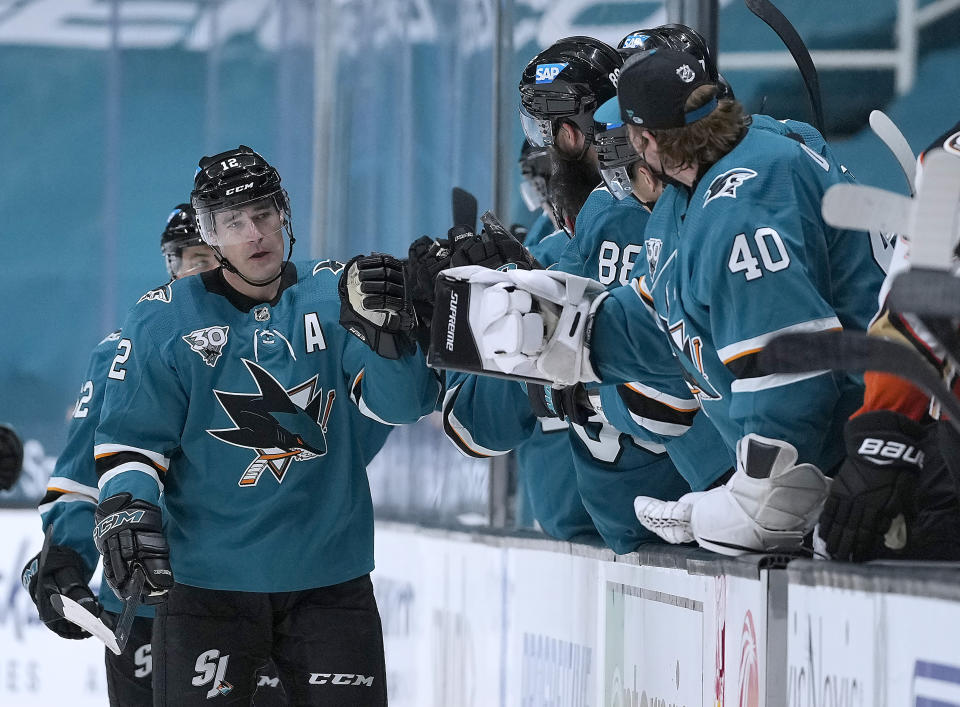 San Jose Sharks center Patrick Marleau (12) is congratulated by teammates after scoring a goal against the Anaheim Ducks during the second period of an NHL hockey game Tuesday, April 6, 2021, in San Jose, Calif. (AP Photo/Tony Avelar)