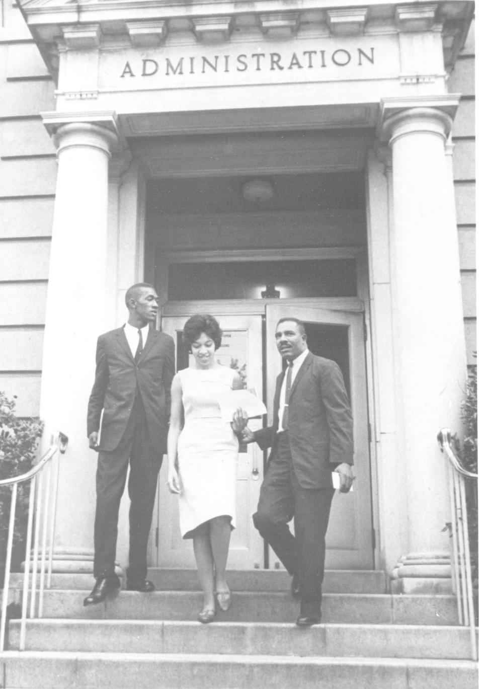 Robert G. Anderson, Henrie Monteith Treadwell and James L. Solomon Jr. on the steps of the Osbourne Administration Building in 1963 at the University of South Carolina. They are the first Black students at USC, post-reconstruction.