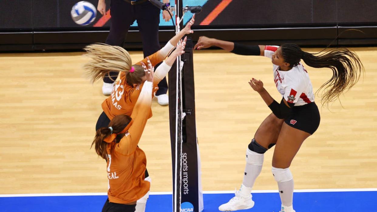 <div>TAMPA, FLORIDA - DECEMBER 14: Devyn Robinson #10 of the Wisconsin Badgers spikes the ball against the Texas Longhorns during the Division I Women’s Volleyball Semifinals held at Amalie Arena on December 14, 2023 in Tampa, Florida. (Photo by Jamie Schwaberow/NCAA Photos via Getty Images)</div>