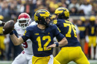 Michigan quarterback Cade McNamara (12) throws a pass in the second quarter of an NCAA college football game against Rutgers in Ann Arbor, Mich., Saturday, Sept. 25, 2021. (AP Photo/Tony Ding)