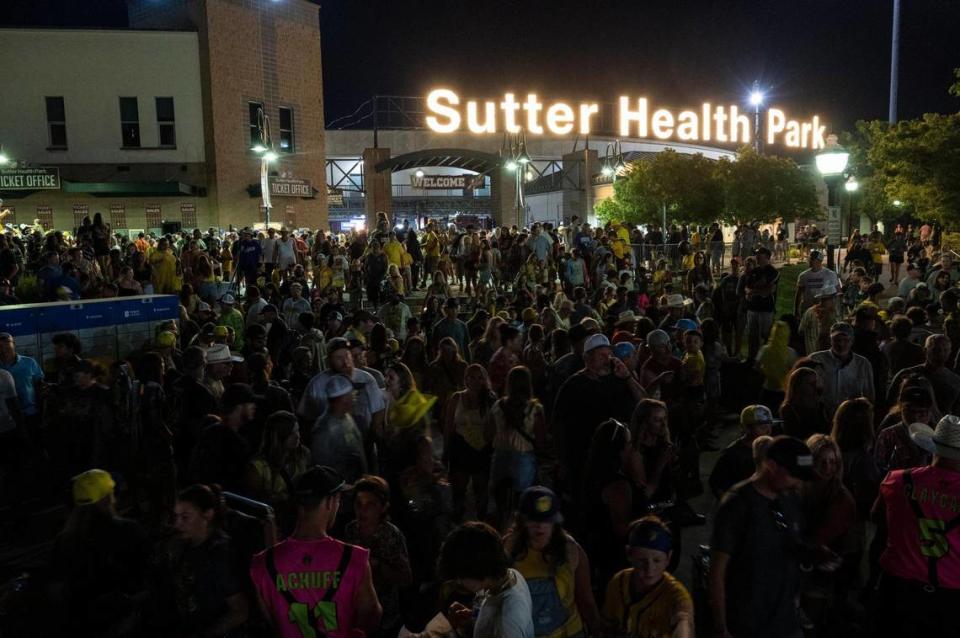 Fans mingle to get autographs from the players after the Savannah Bananas World Tour on Saturday, July 29, 2023, at Sutter Health Park in West Sacramento.