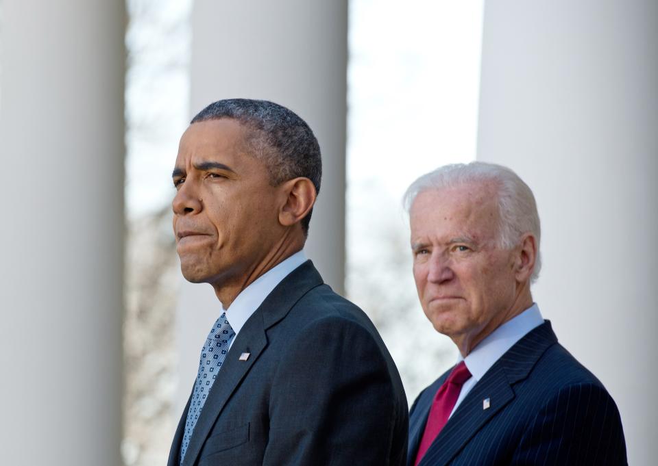 US President Barack Obama speaks about the Affordable Care Act, also known as Obamacare, with Vice President Joe Biden in the Rose Garden at the White House in Washington on April 1, 2014. Hundreds of thousands of Americans rushed to buy Obama's new health insurance plans on March 31, prompting a victory lap from a White House that paid a steep political price for its greatest achievement. The scramble to sign up under Obama's health care law at the end of a six-month enrollment window caused website glitches and long lines at on-the-spot enrollment centers.    AFP PHOTO/Nicholas KAMM        (Photo credit should read NICHOLAS KAMM/AFP via Getty Images)