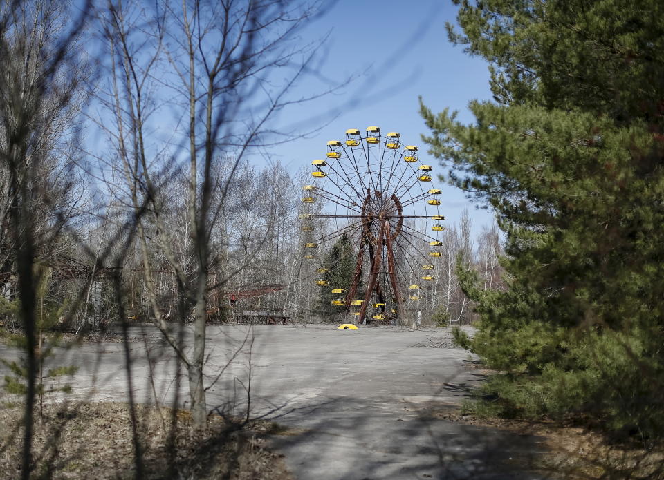 A ferris wheel is seen in the abandoned city of Pripyat near the Chernobyl nuclear power plant in Ukraine March 28, 2016.  REUTERS/Gleb Garanich