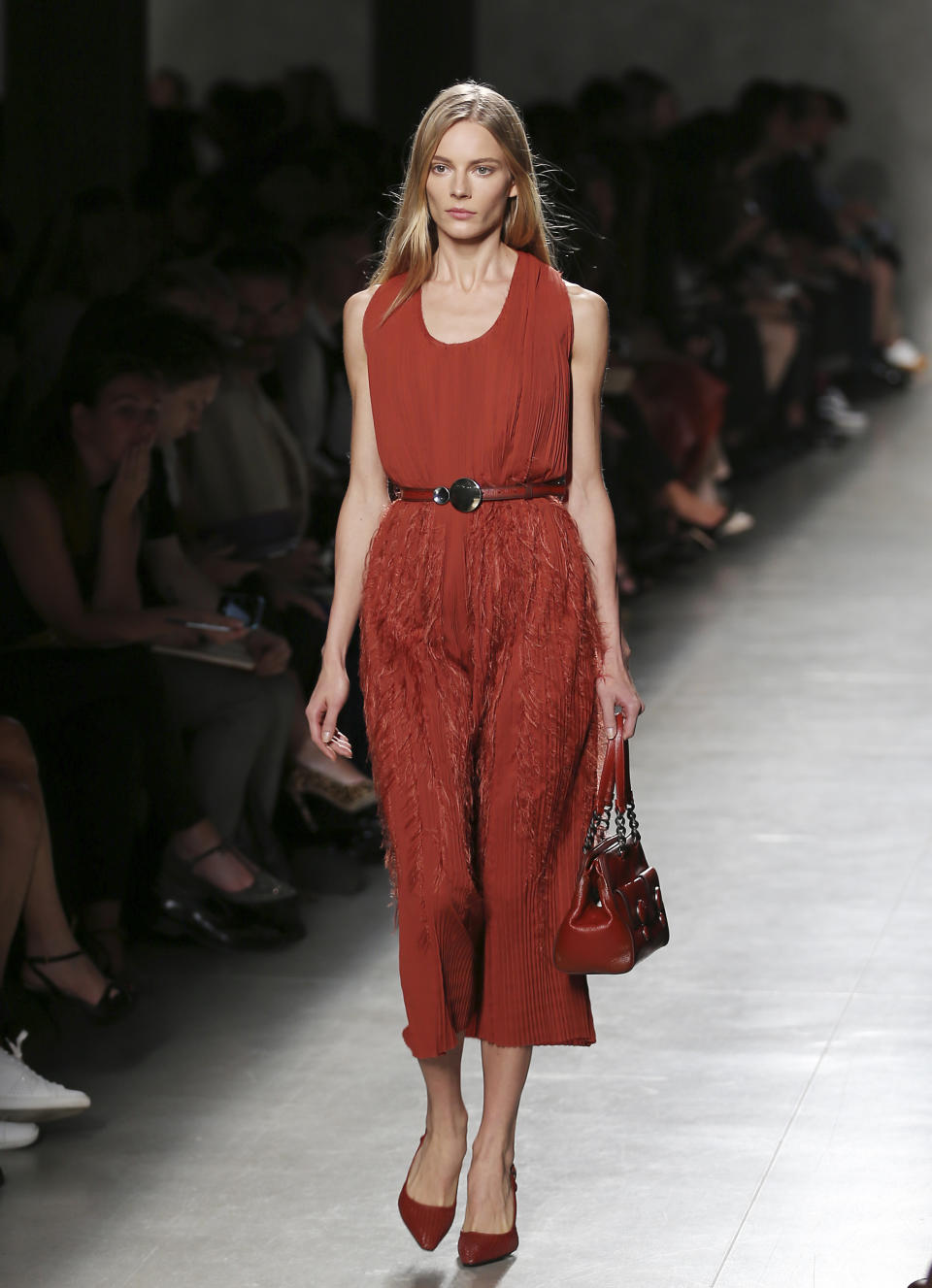 A model wears a creation for Bottega Veneta's women's Spring-Summer 2014 collection, part of the Milan Fashion Week, unveiled in Milan, Italy, Saturday, Sept. 21, 2013. (AP Photo/Antonio Calanni)