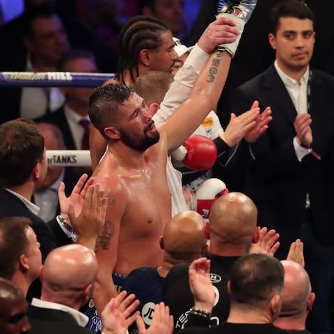 Tony Bellew celebrates victory over countryman David Haye - Credit: AFP