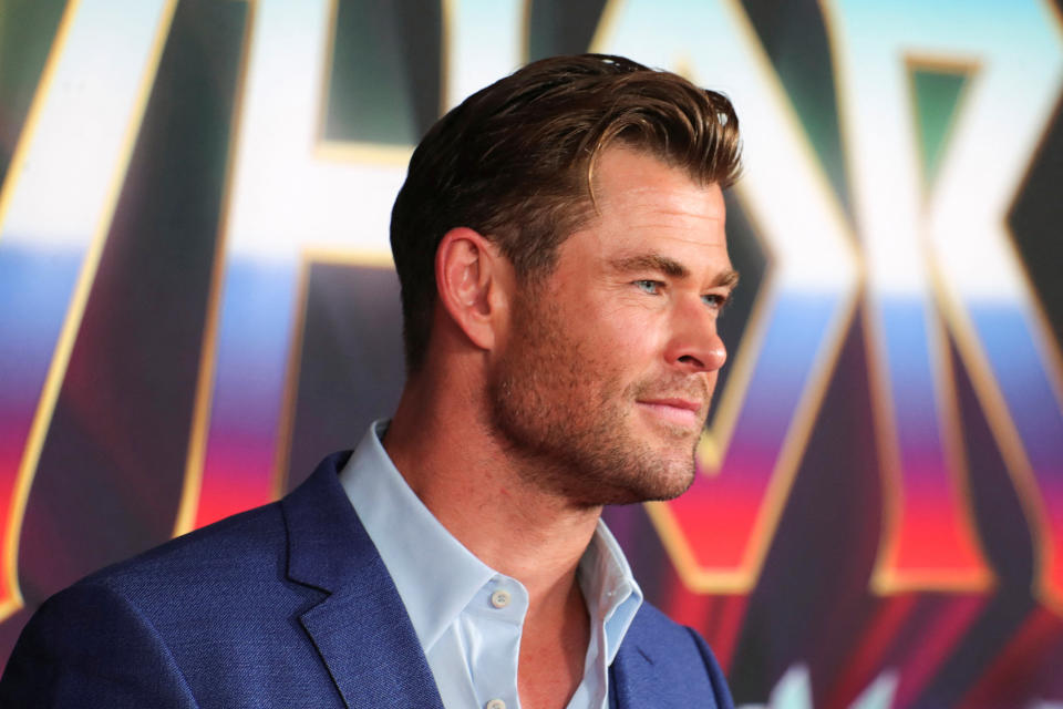 Chris Hemsworth poses on the red carpet at the premiere of Marvel Studios 