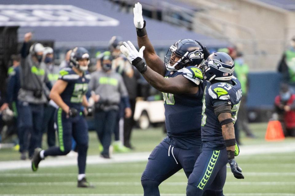 Seattle Seahawks defensive tackle Jarran Reed celebrates a sack. The Seattle Seahawks played the Los Angeles Rams in a NFL wildcard playoff game at Lumen Field in Seattle, Wash., on Saturday, Jan. 9, 2021.