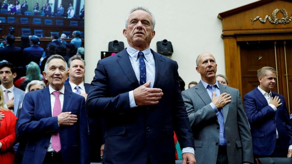 PHOTO: Democratic presidential Robert F. Kennedy Jr. stands to recite the Pledge of Allegiance at a House Judiciary Select Weaponization of the Federal Government Subcommittee hearing on Capitol Hill in Washington, D.C., July 20, 2023. (Jonathan Ernst/Reuters)