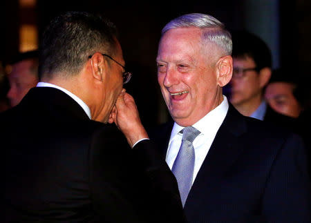 U.S. Secretary of Defense James Mattis speaks with Malaysia's Defence Minister Hishammuddin Hussein at the 16th IISS Shangri-La Dialogue in Singapore June 2, 2017. REUTERS/Edgar Su