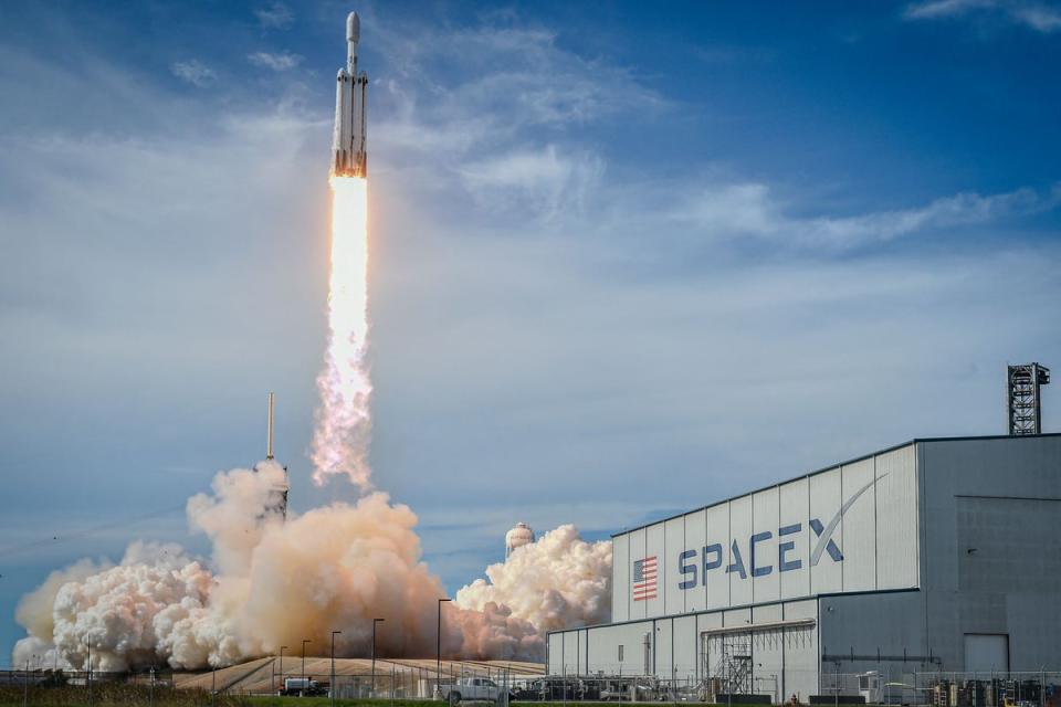 <p>A SpaceX Falcon Heavy rocket lifts off from Launch Complex 39A at NASA's Kennedy Space Center, Florida</p> (AFP via Getty Images)