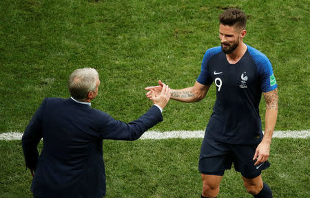 Soccer Football - World Cup - Final - France v Croatia - Luzhniki Stadium, Moscow, Russia - July 15, 2018 France's Olivier Giroud shakes hands with coach Didier Deschamps after being substituted off REUTERS/Christian Hartmann