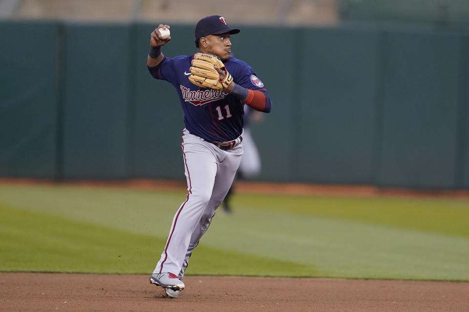 Minnesota Twins second baseman Jorge Polanco throws out Oakland Athletics' Luis Barrera at first base during the fourth inning of a baseball game in Oakland, Calif., Monday, May 16, 2022. (AP Photo/Jeff Chiu)