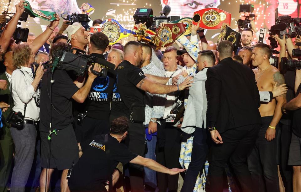 Tensions boil over: Tyson Fury and Oleksandr Usyk clashed during Friday night’s fiery weigh-in (Getty Images)