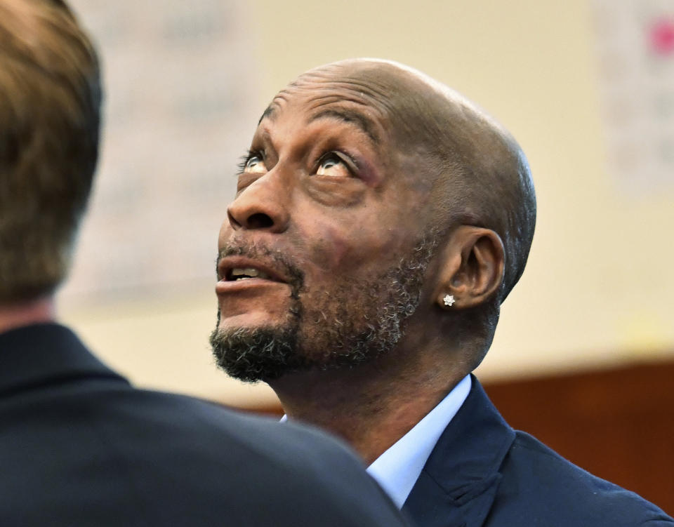 FILE - In this July, 9, 2018, file photo, plaintiff DeWayne Johnson looks up during a brief break as the Monsanto trial in San Francisco. A San Francisco jury's $289 million verdict in favor of the school groundskeeper who says Roundup weed killer caused his cancer will face its first court test. Agribusiness giant Monsanto will argue at a hearing on Wednesday, Oct. 10, 2018 that Judge Suzanne Bolanos should throw out the verdict in favor of DeWayne Johnson. (Josh Edelson/Pool Photo via AP, File)