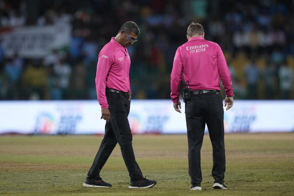 Umpires inspect the field after a spell of rain interrupted the play during the Asia Cup cricket match between India and Pakistan in Colombo, Sri Lanka, Sunday, Sept.10, 2023. (AP Photo/Eranga Jayawardena)