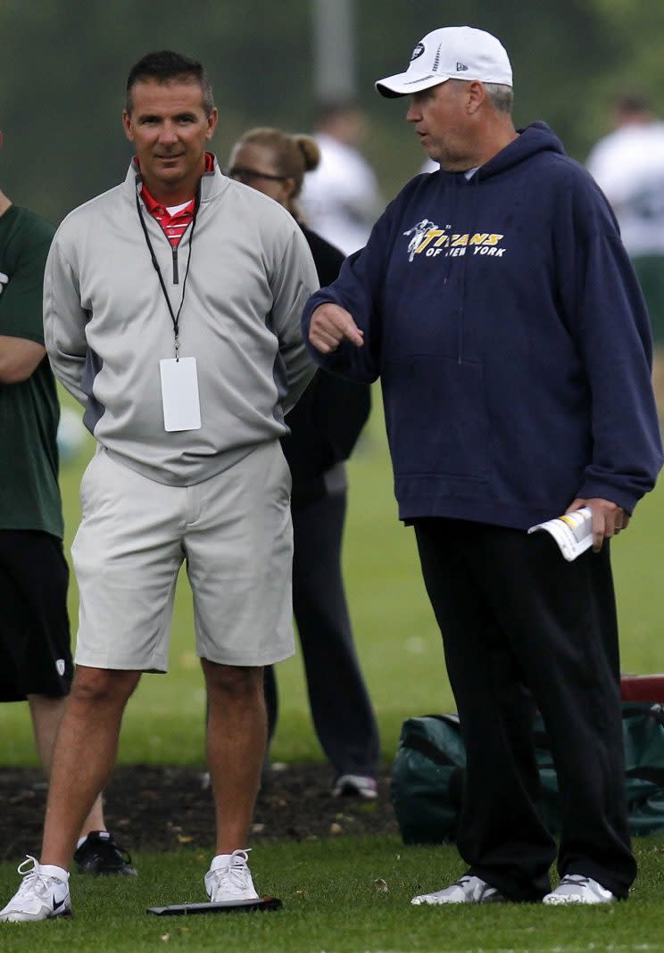 Rex Ryan talks with Ohio State football coach Urban Meyer. (Photo by Jeff Zelevansky/Getty Images)